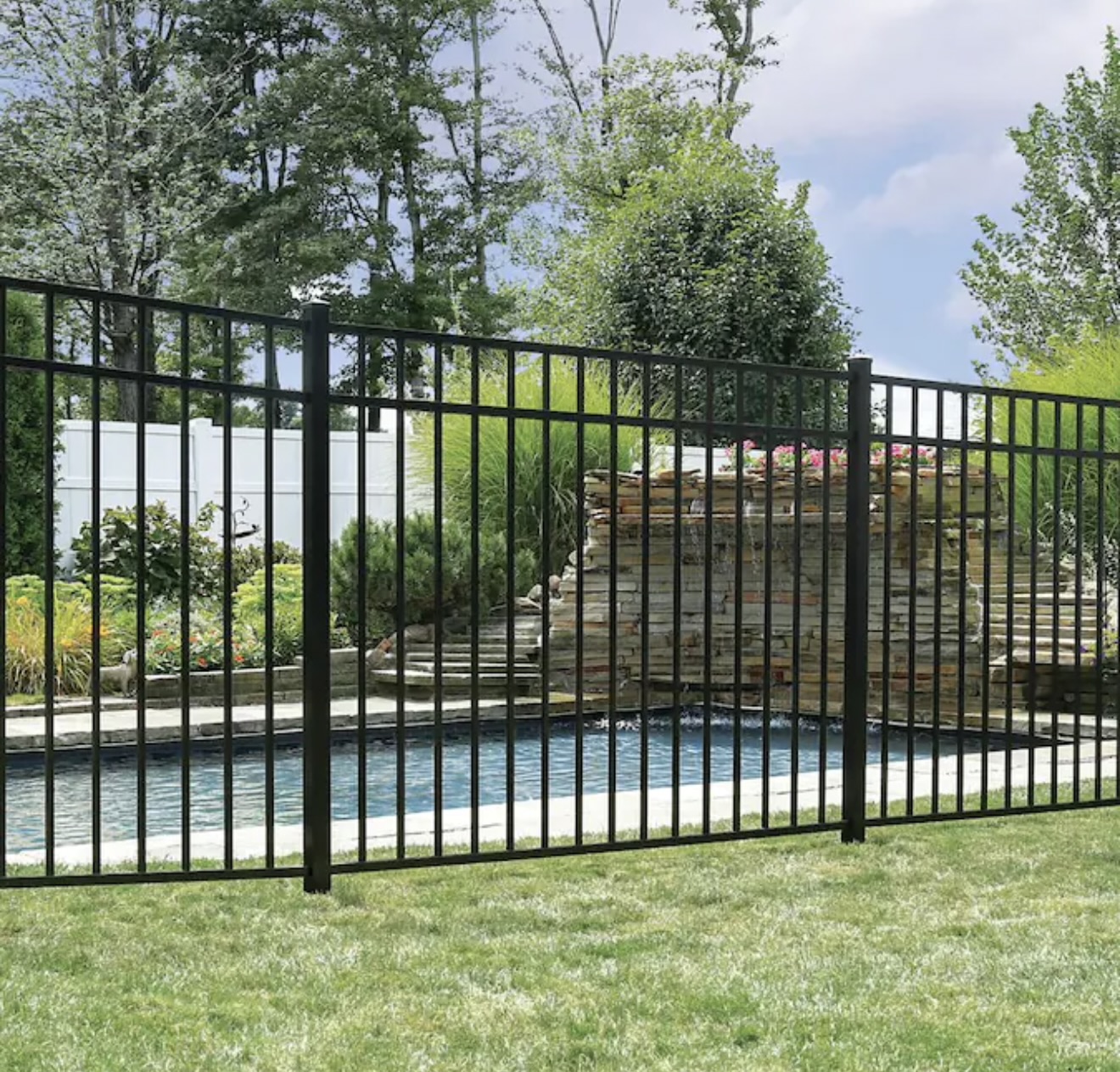 Black aluminum 3 rail fence by a pool